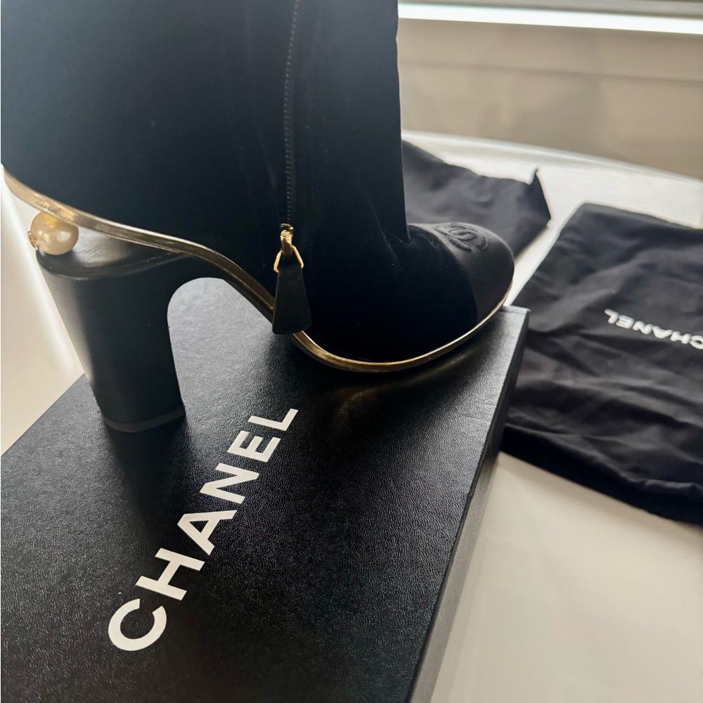 CHANEL Black Heeled Boots with Gold Accents